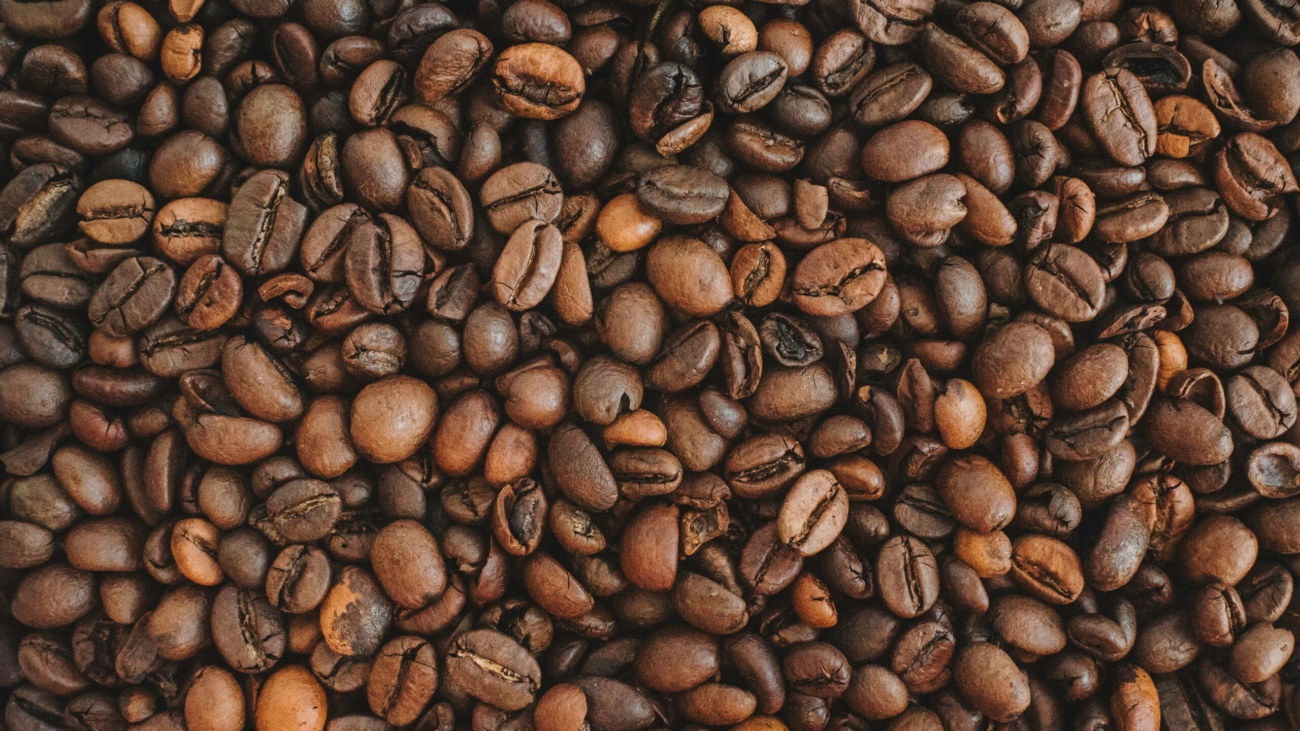 brown coffee beans on brown wooden table